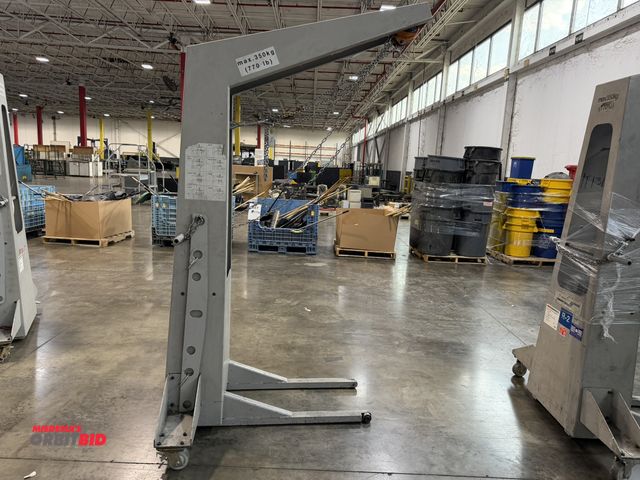 Lot 1-5442 - (1) Muller Martini, 770 lb. max capacity crane/hoist, includes (2) 42" long steel lift attachments.