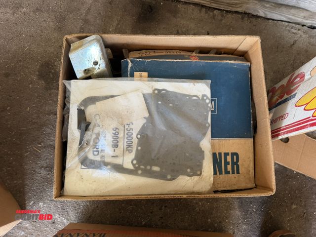 Lot 1-8552 - (1) box of assorted vintage car parts, includes gaskets, 1963 Pontiac parts, pulleys, trim pieces, a...
