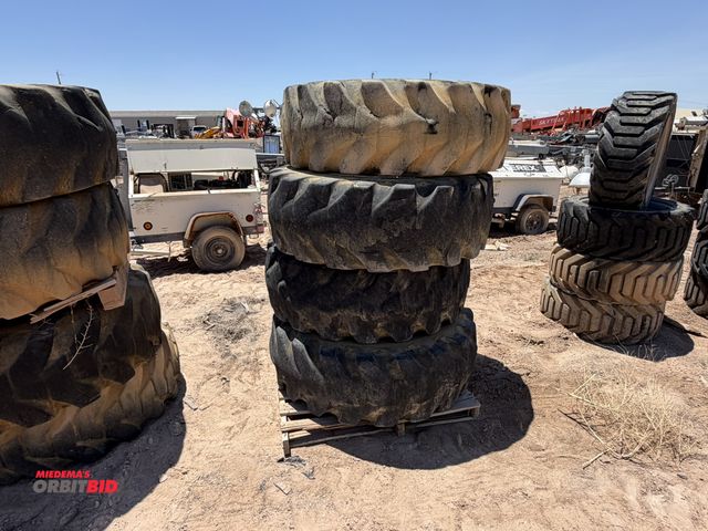 Lot 1-18240 - (4) Firestone 17.5-25 tires on 10-bolt rim, tires are used
