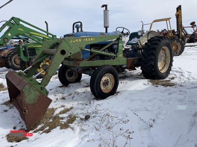 Lot 1-11768 - (1) Ford 5000 2-WD tractor with a John Deere 46A loader attachment, S/N SNE046A009213C, and a 60" bu...