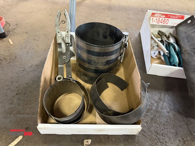 Lot 1-18461 - (1) oil filter removal tool with various adapters.