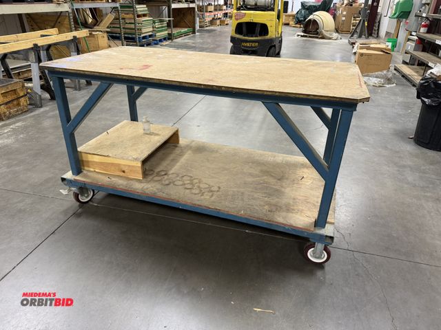 Lot 1-19466 - (1) rolling steel heavy duty shop table, 72" x 36.5" x 40" tall, hard rubber casters with steer and ...
