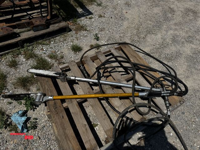 Lot 1-6989 - Lot of (2) hydraulic driven chainsaws, approx. 60" long, 14" bar, both are in working condition.