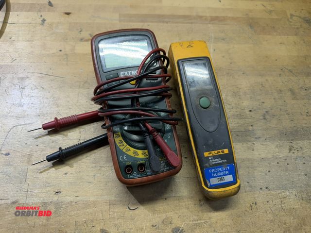 Lot 1-18860 - (1) Fluke non-contact thermometer, and (1) Extech manual ranging multi meter, model 410.
