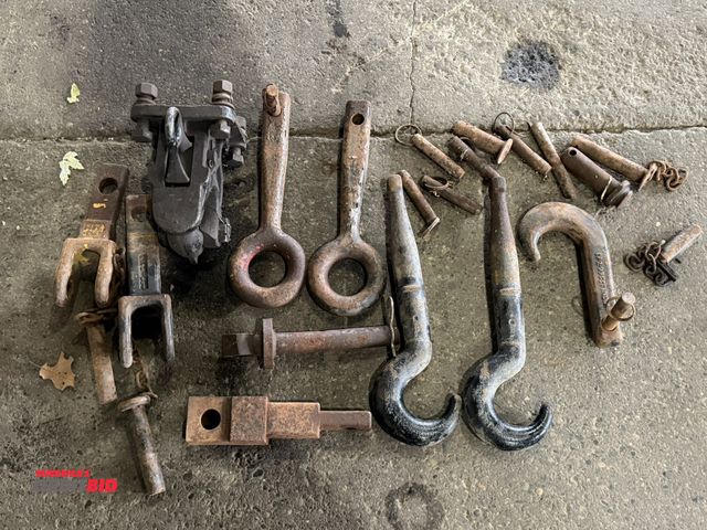 Lot 1-1134 - Lot of assorted towing related attachments, includes eye bolts, hooks, various pins, (1) pintle styl...