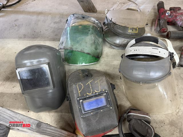 Lot 1-1369 - Lot of assorted full face masks, (2) welding helmets, (1) set of ear muffs, and assorted full face s...