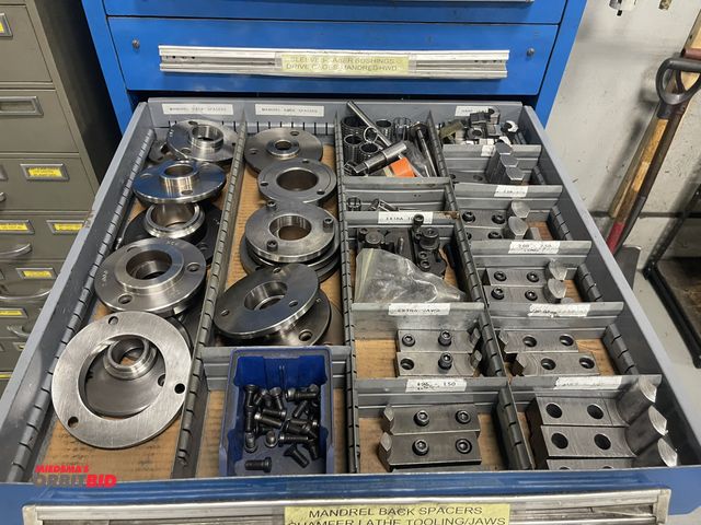 Lot 1-19285 - Contents of 1 drawer, includes mandrel back spacers, chamfer lathe tooling jaws, and more.
