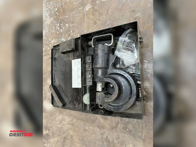 Lot 1-1440 - (1) make and model unknown hydraulic punch attachment with various dies and steel case.