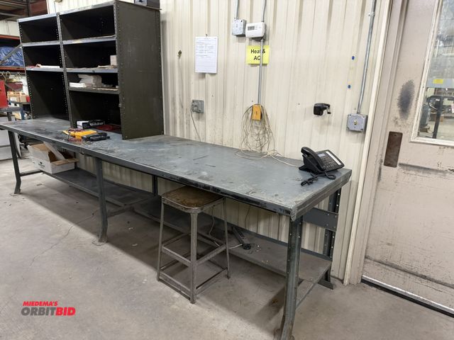 Lot 1-14527 - (1) 12' long x 34.5" tall x 34" deep steel work bench consisting of (2) 6' benches bolted together a...