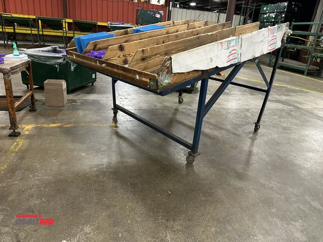 Lot 1-14378 - (1) 72" width x 93" depth heavy duty steel tilted table with 38" at low point and 55-1/2" at high po...