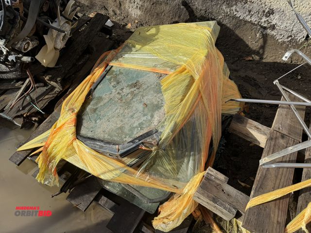 Lot 1-16006 - (1) skid of assorted Caterpillar Skid Steer glass doors, conditions are unknown, some glass may be b...