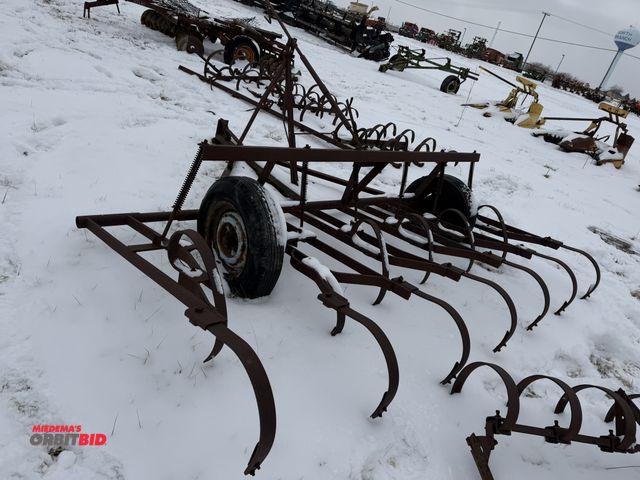 Lot 1-11462 - (1) 9.5' wide cultivator/drag, pin style hitch, manual adjustment, both tires will need repair, winn...
