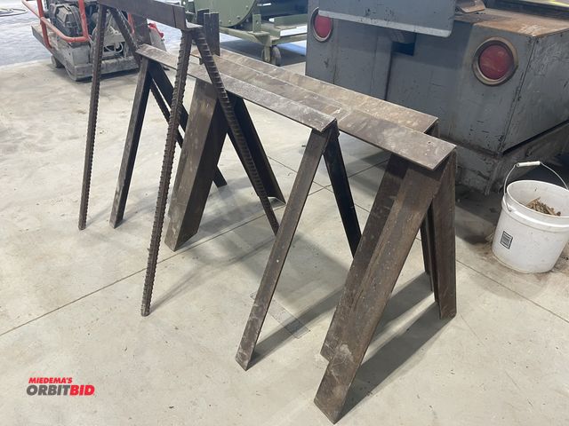 Lot 1-18814 - Lot of (3) steel saw horses, approx. 38" x 25" tall, and (1) steel saw horse, 23.5" x 31" tall.