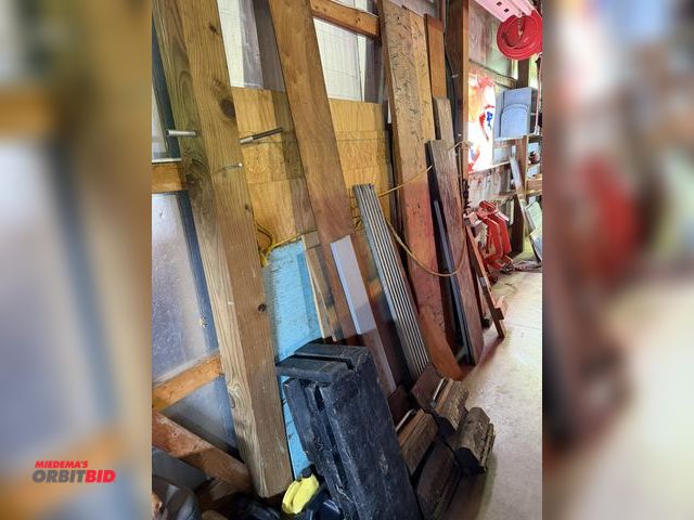 Lot 1-12329 - Large lot of assorted wood, includes wood shown in corner in photo.