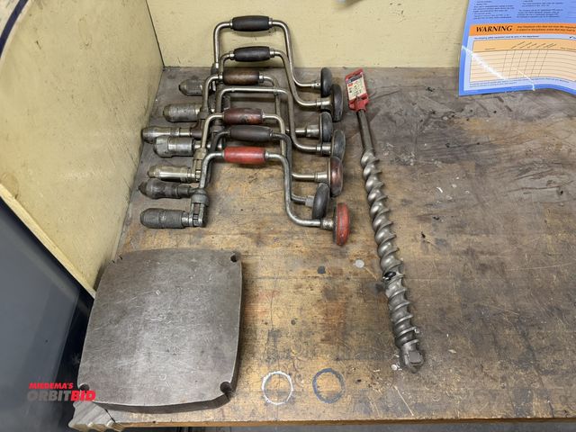 Lot 1-1050 - (7) Vintage hand drills, (1) Bosch "wild bore"  1-1/2" x 23" drill bit (18" drill surface), and (1) ...