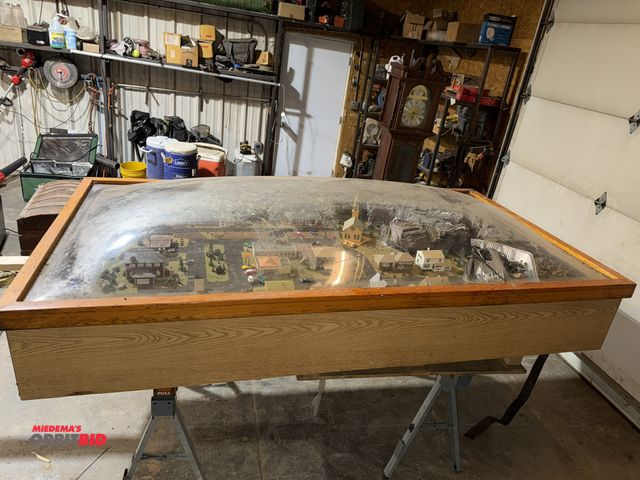 Lot 1-1507 - (1) approx. 8' long x 14.5" tall x 52" deep collectible train set, and wood framed plastic dome.