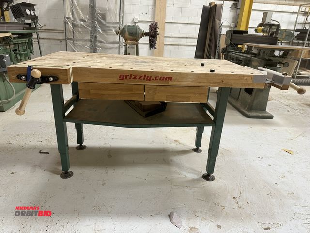 Lot 1-16772 - (1) Grizzly 60" width x 35" height x 30" depth steel framed work bench with manually adjustable heig...