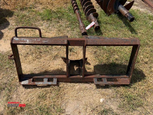 Lot 1-9586 - (1) post hole auger skid steer attachment frame, frame only.