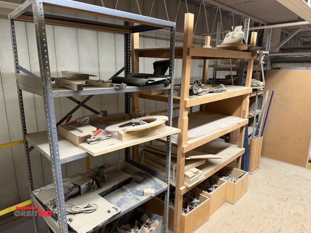 Lot 1-16650 - (2) metal shelving units with assorted items, includes router bits, drawer slides, wood dowels, Dest...