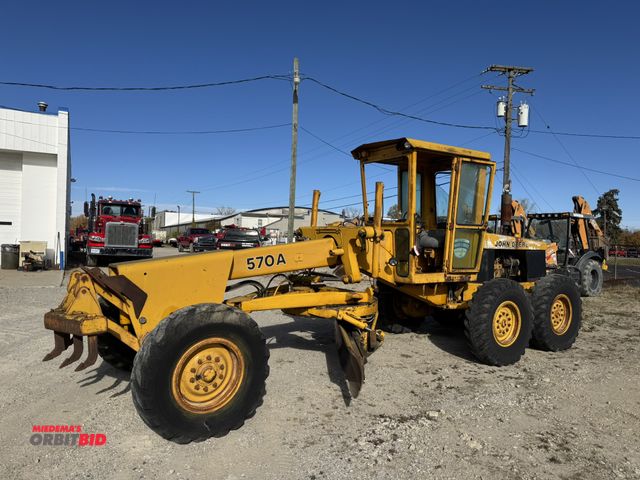 Lot 1-18288 - (1) John Deere 570A motor grader, 85 HP engine, 12' blade, power shift transmission, 8 forward and 4...