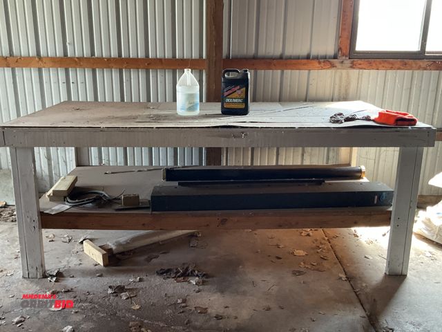 Lot 1-12006 - 96” width x 36 1/2”height x 49”depth wood work bench with contents, a 59” width x 4” thick by 8” dee...