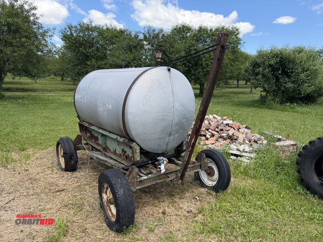 Lot 1-102597 - (1) Aluminum 520 gallon water tank, mounted on running gear, will need tires, all four tires are fla...