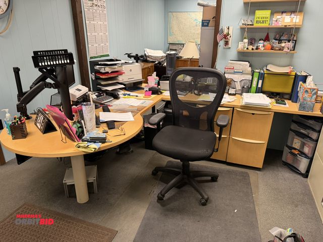 Lot 1-15520 - (1) L-shaped wooden desk, approx. 84" x 118" with dual monitor holders, does not include contents, d...