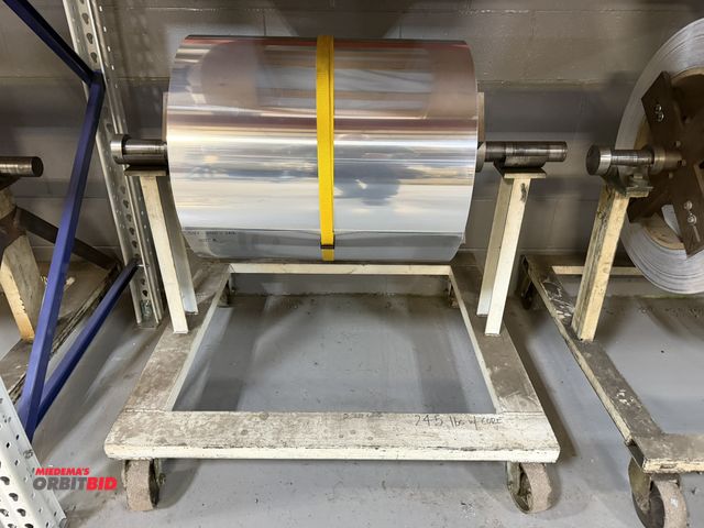 Lot 1-18704 - (1) 24" wide partial roll of bright aluminum, .012" thickness, 262 lb. of net weight, includes cart,...