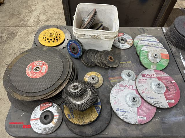 Lot 1-1394 - Large lot of assorted new and used grinding wheels, cut off wheels, saw blades, etc., includes (4) u...
