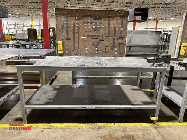 Lot 1-5217 - (1) custom built 84.5" length x 37" height x 36" depth heavy duty steel work bench with lower shelf,...