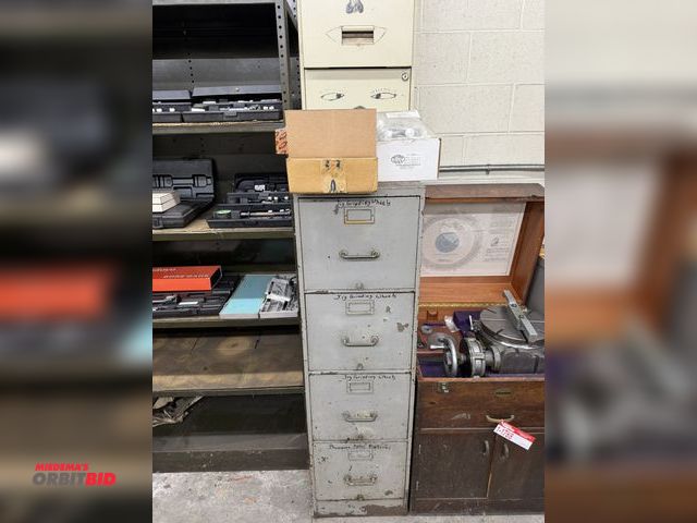 Lot 1-1789 - (1) 4-drawer file cabinet filled with assorted jig grinding wheels by Moore Tools, various sizes.