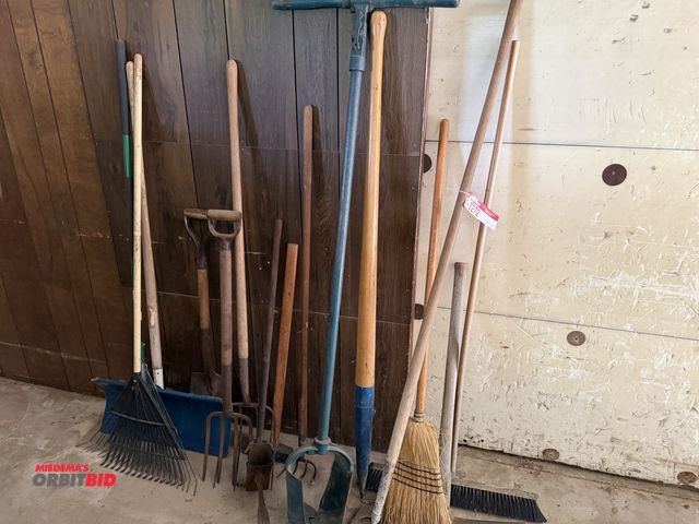 Lot 1-3272 - Assorted shovels, rake, broom, pitch fork, post hole digger, axe, and more