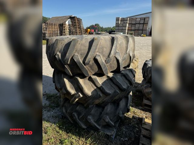 Lot 1-6924 - Lot of (1) 18.4-26 tire, (2) 18.4-26 tractor tires on rims, tires are loaded, winning bidder respons...