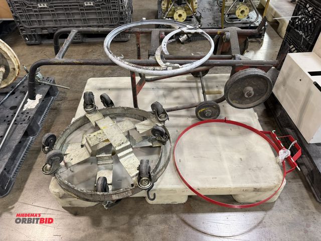Lot 1-5461 - (1) 2-wheel, 55 gallon drum lid, (3) drum rings, and (2) 6-wheel rolling bases.