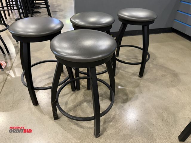 Lot 1-11160 - (4) 24" tall metal framed swivel top bar stools with vinyl padded seats