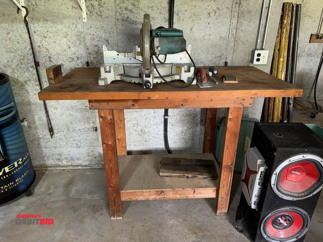 Lot 1-618 - (1) Makita, model LS1220, 12" miter saw, 120V, with wood table, 58.5" x 28" x 42" tall.