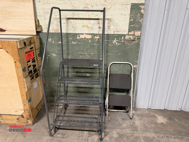 Lot 1-17583 - (1) 4-step rolling safety warehouse ladder with 29" tall handrails, and (1) Safety 1st 2-step collap...