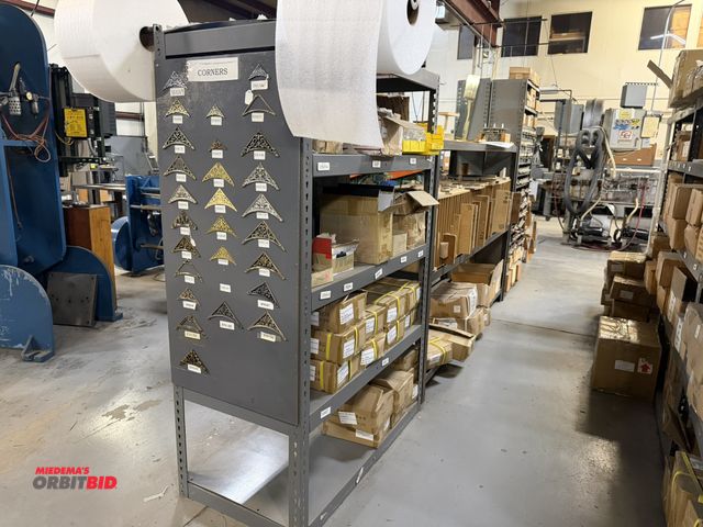 Lot 1-18907 - Contents of rack, includes assorted clock corners, wood jigs, metal pull out drawer with assorted cl...