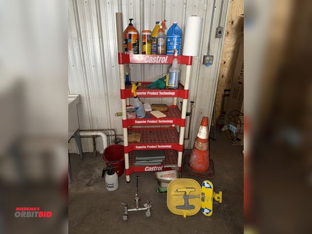 Lot 1-13192 - (1) plastic shelving units with contents, includes Scotts Wizz Broadcaster, emergency eye wash stati...