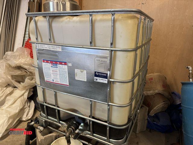Lot 1-14219 - (1) approx. 275 gallon poly tank with forkable steel cage, bottom drain, contents in tank is unknown...