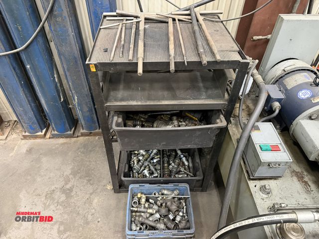Lot 1-15396 - (1) steel table, 24" x 19.5",  with assorted quick connect hydraulic fittings, pipe fittings, and cu...