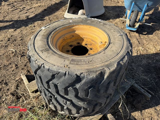 Lot 1-2933 - (1) set of skid steer tires and rims, 8-lug with 300/70R16.5 IND tires.