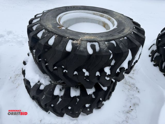 Lot 1-11641 - (1) set of Titan Track Loader 43 x 16-20 tires mounted on 6-bolt rims, tires appear to be new.