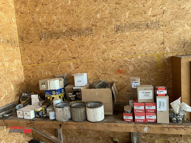 Lot 1-14186 - Entire contents of shelves and cabinet above work bench, includes several various air filters, assor...