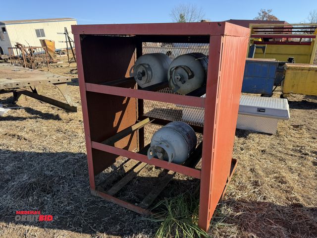 Lot 1-2938 - (1) 12-bottle propane storage unit, 43" x 32" x 56" tall, forkable, also includes (3) 20 lb. propane...