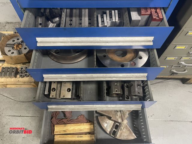 Lot 1-19294 - Contents of drawer #6, 7, 8, and 9, includes chuck jaws, spacers, and tool holders.