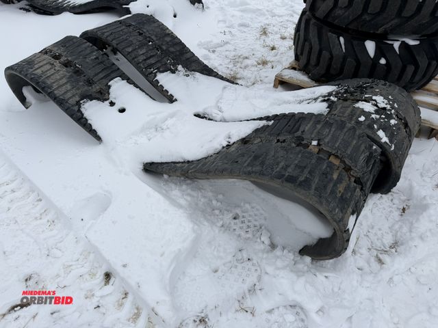 Lot 1-11690 - Lot of (2) used skid steer tracks, approx. 17.5" wide x 82" diameter.
