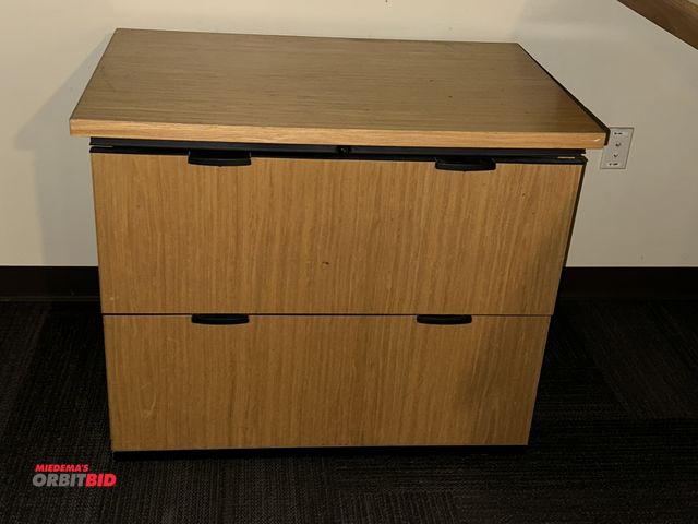 Lot 1-17803 - (1) 2-drawer wood grain lateral file cabinet.