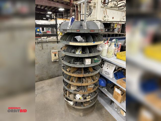 Lot 1-15221 - (1) 7-tier lazy Susan style parts rack, approx. 66" tall, includes assorted socket head cap screws, ...