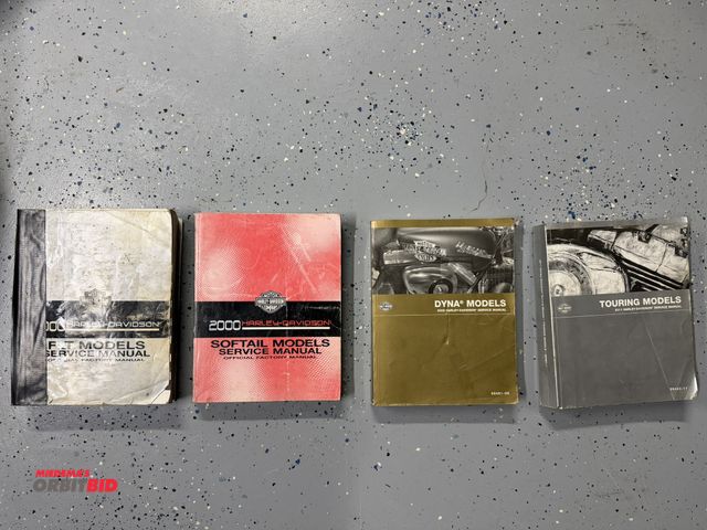 Lot 1-8298 - Lot of (4) various Harley Davidson service manuals, includes 2011 Harley Davidson Touring Models, #9...